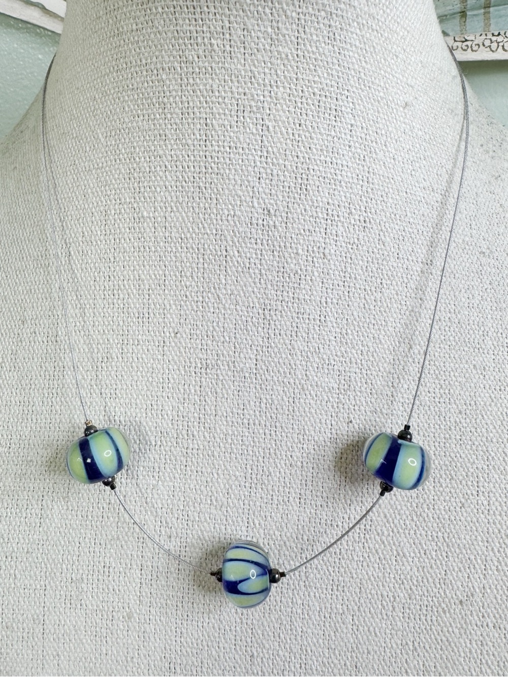 Art Glass Bead Necklace Dark Blue and Lime Green Stripe on Simple Wire